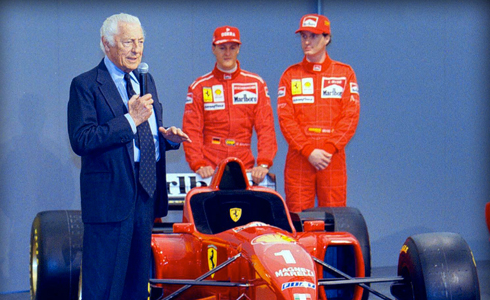 The Avvocato presents the New Ferrari 310  model, in 1986.  With him the FI drivers Michael Schumacher and Eddie Irvine.